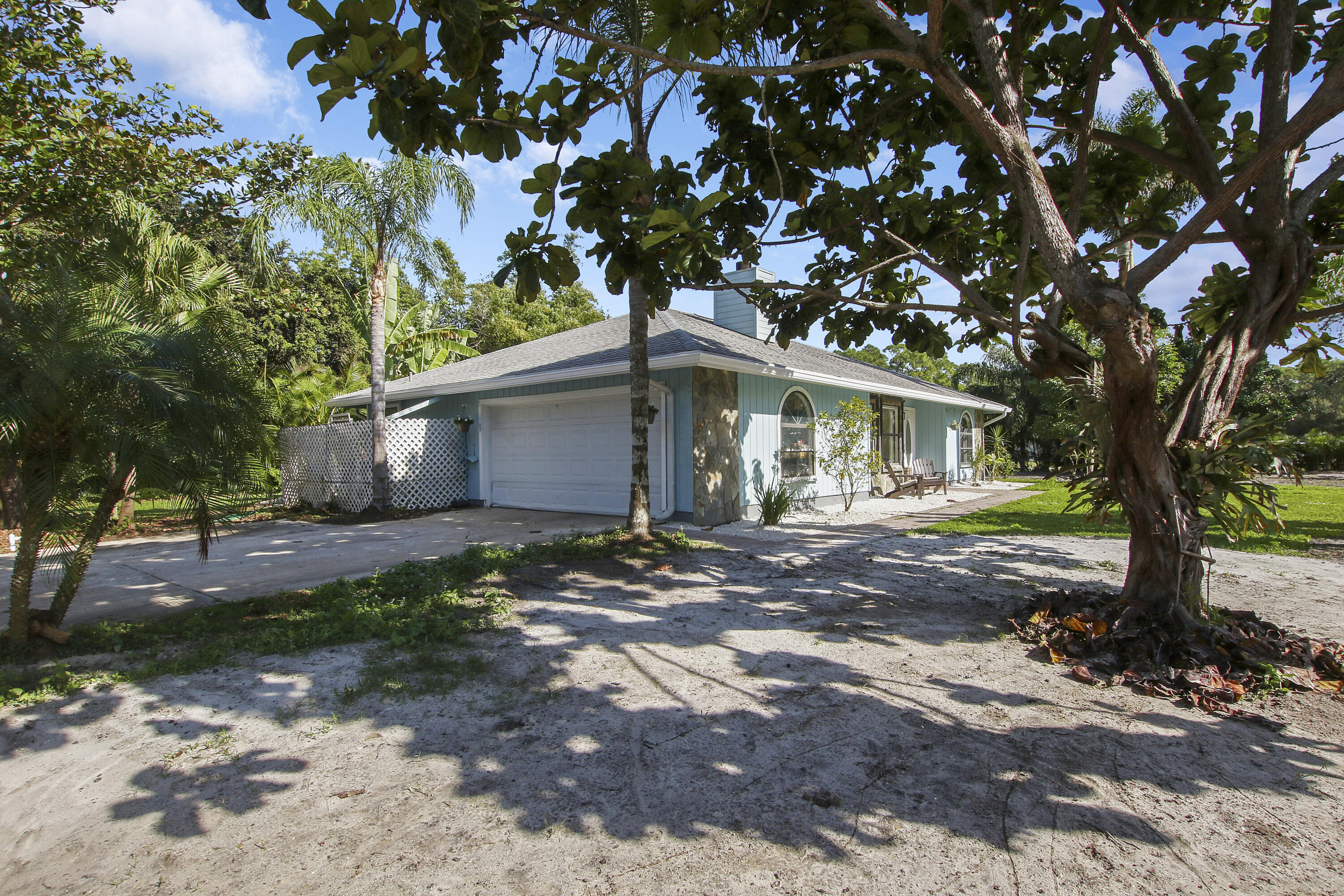 13431 153rd Road North Jupiter, FL 33478 - Photo 36 of 44 a view of a house with a tree in the background