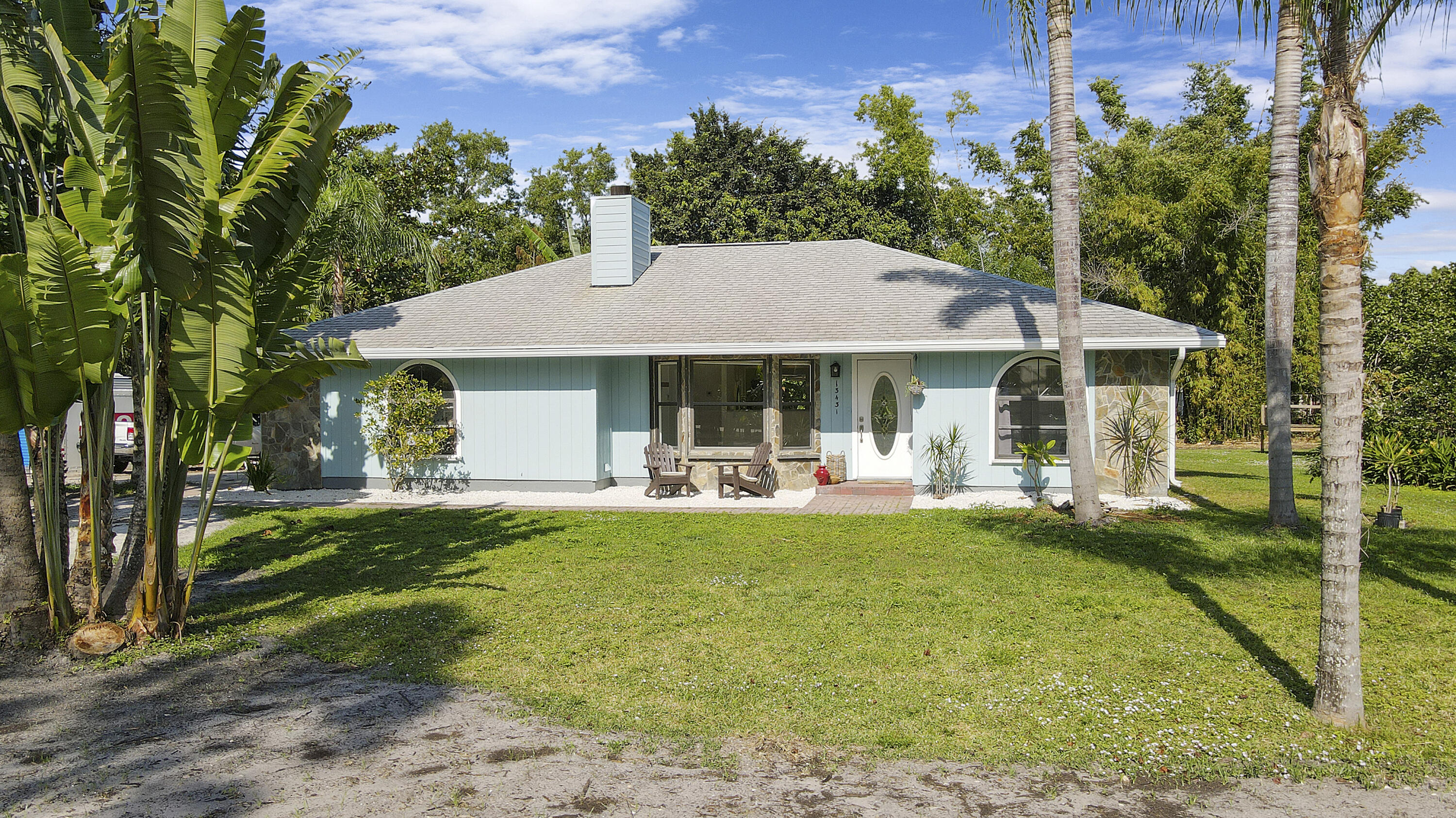 13431 153rd Road North Jupiter, FL 33478 - Photo 37 of 44 a view of a house with a yard patio and swimming pool
