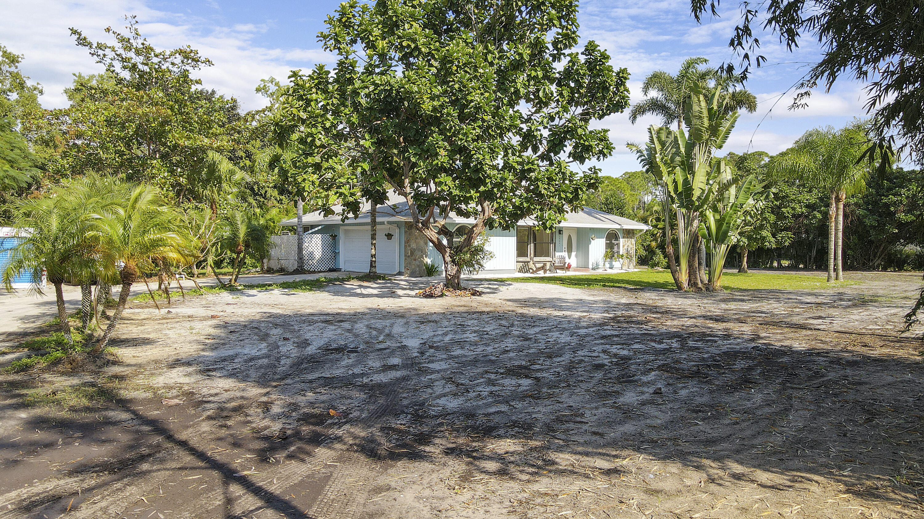 13431 153rd Road North Jupiter, FL 33478 - Photo 38 of 44 a view of road with large trees