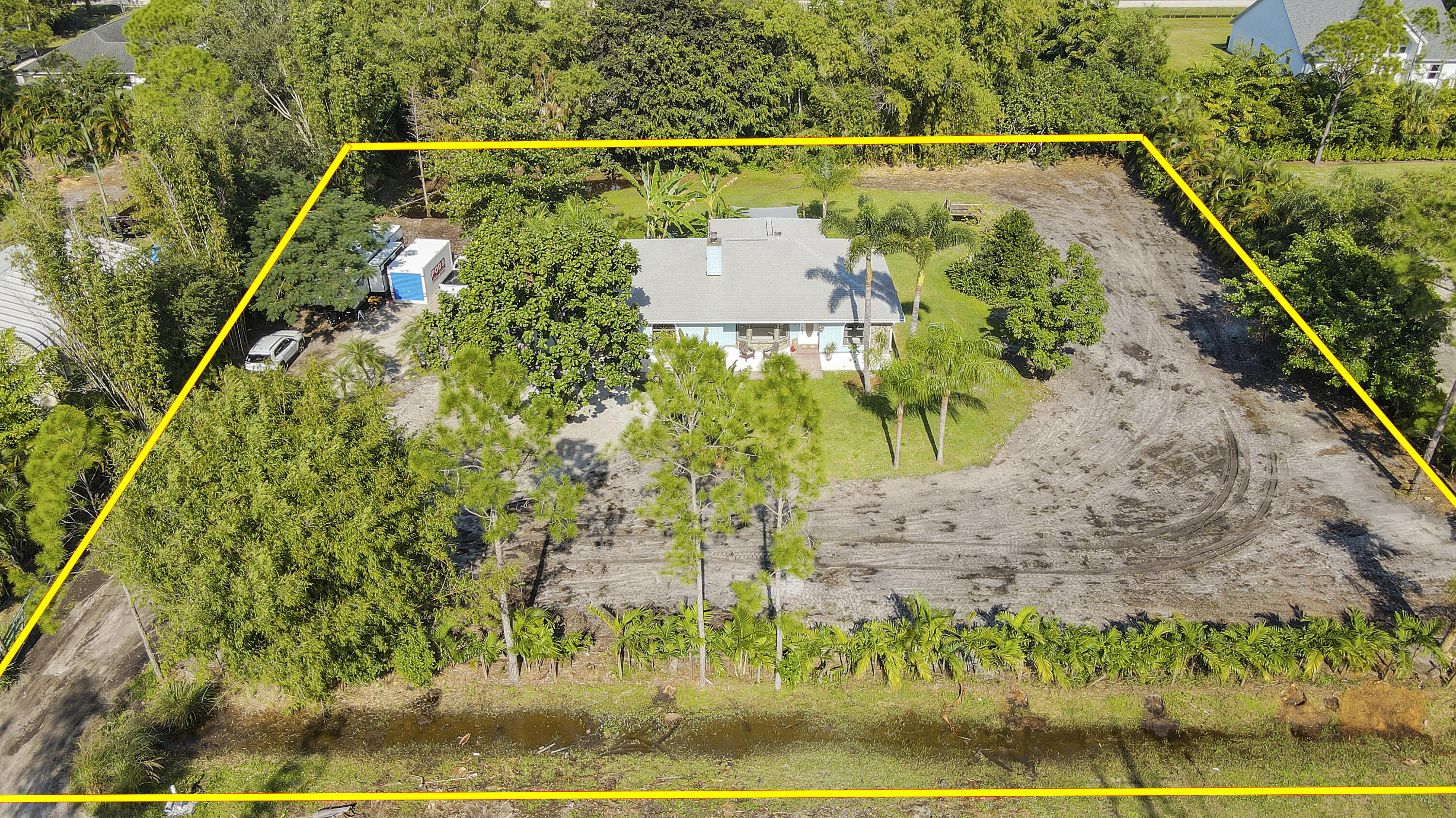 13431 153rd Road North Jupiter, FL 33478 - Photo 39 of 44 a view of a yard with a garden