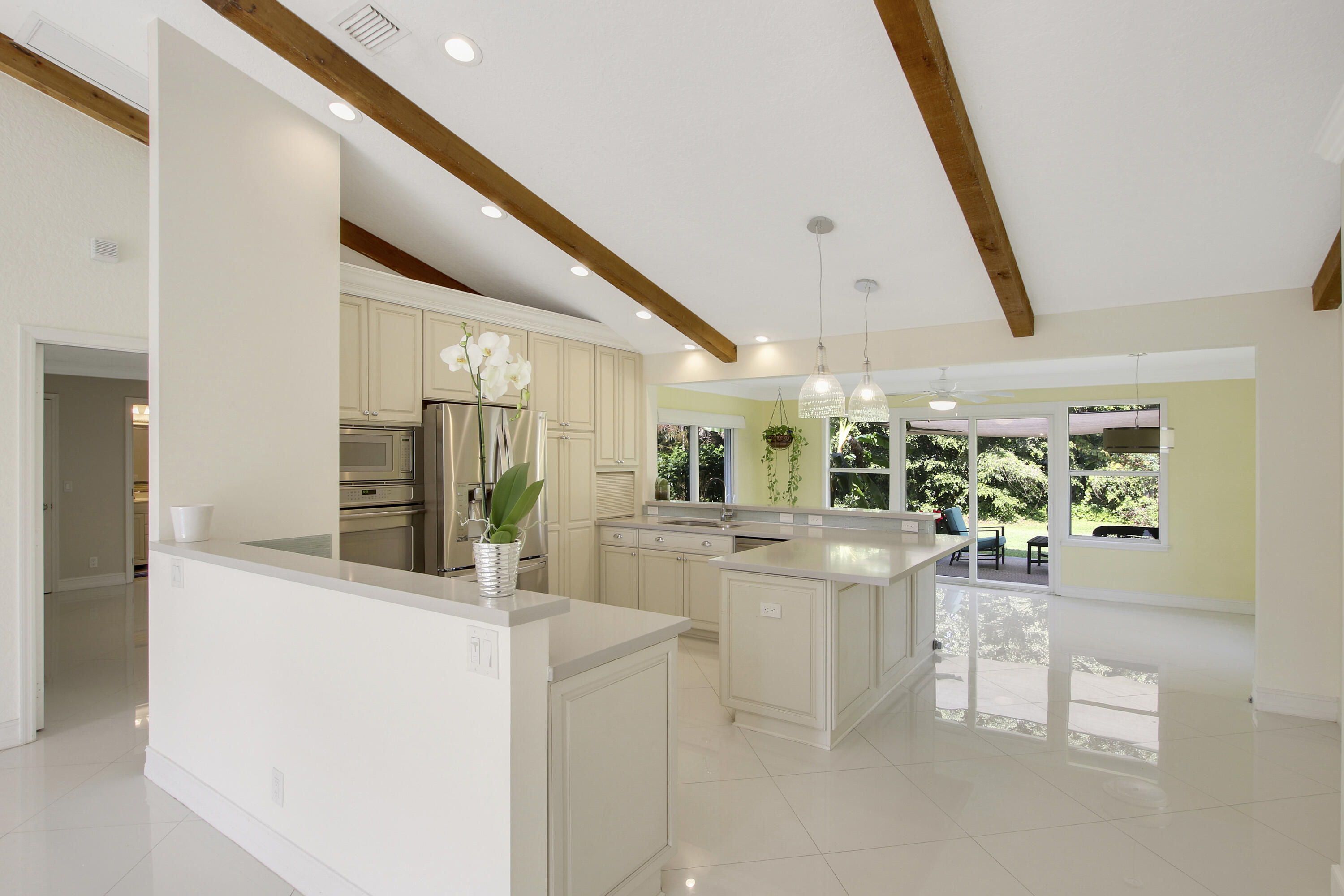 13431 153rd Road North Jupiter, FL 33478 - Photo 7 of 44 a view of kitchen with furniture and large window