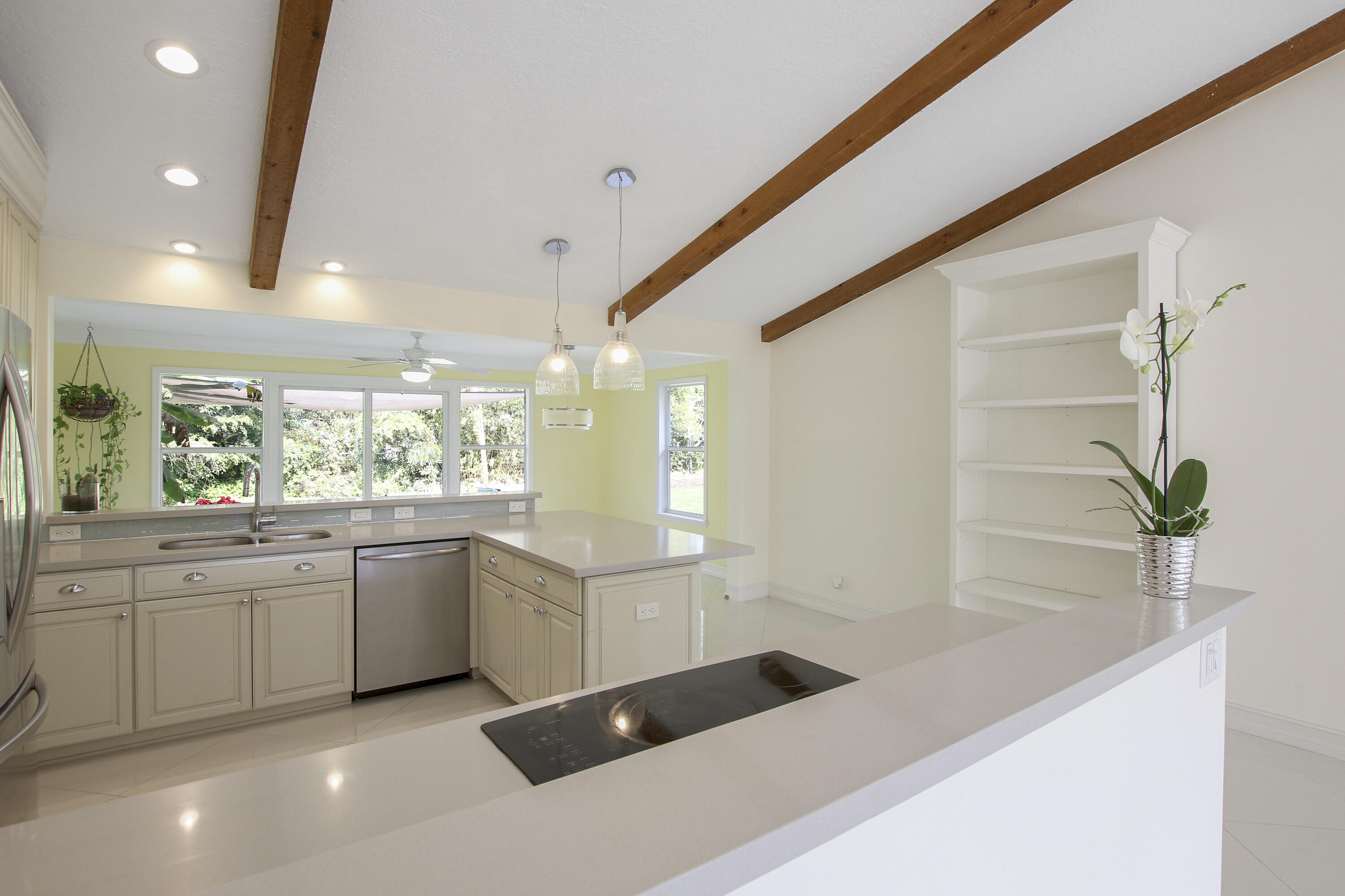 13431 153rd Road North Jupiter, FL 33478 - Photo 9 of 44 a large white kitchen with a large window