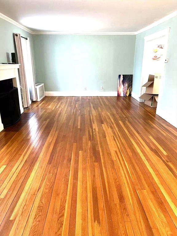 142 Jackson Street Newton, MA 02459 - Photo 11 of 16 a bedroom with a bed and wooden floor
