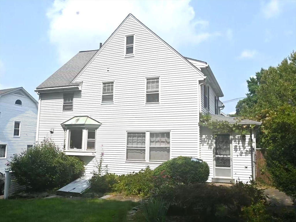 142 Jackson Street Newton, MA 02459 - Photo 14 of 16 a front view of a house with a yard