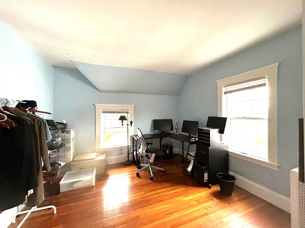 142 Jackson Street Newton, MA 02459 - Photo 3 of 16 a view of a workspace with furniture and a window