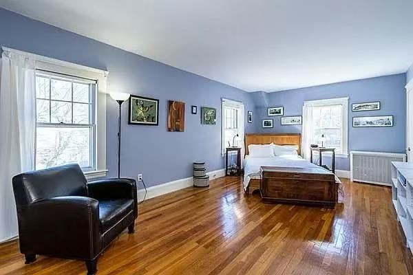 142 Jackson Street Newton, MA 02459 - Photo 5 of 16 a bedroom with furniture and a wooden floor