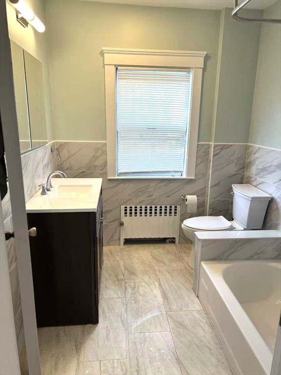 142 Jackson Street Newton, MA 02459 - Photo 6 of 16 a bathroom with a sink a toilet and mirror