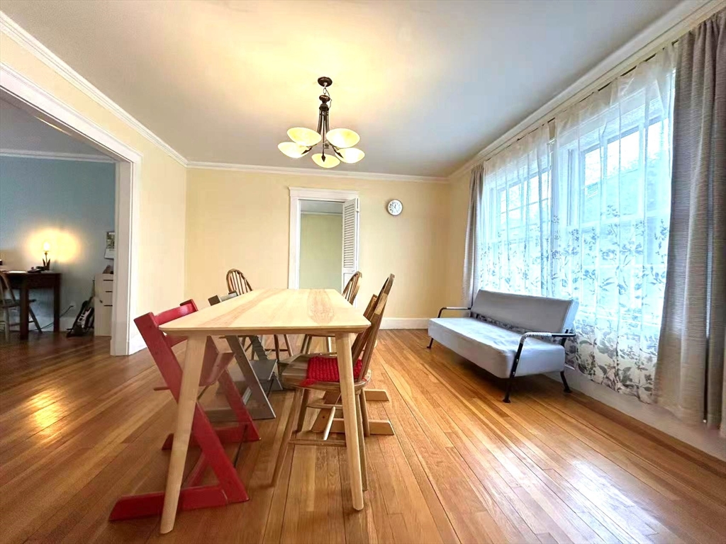 142 Jackson Street Newton, MA 02459 - Photo 7 of 16 a view of a dining room with furniture window and wooden floor