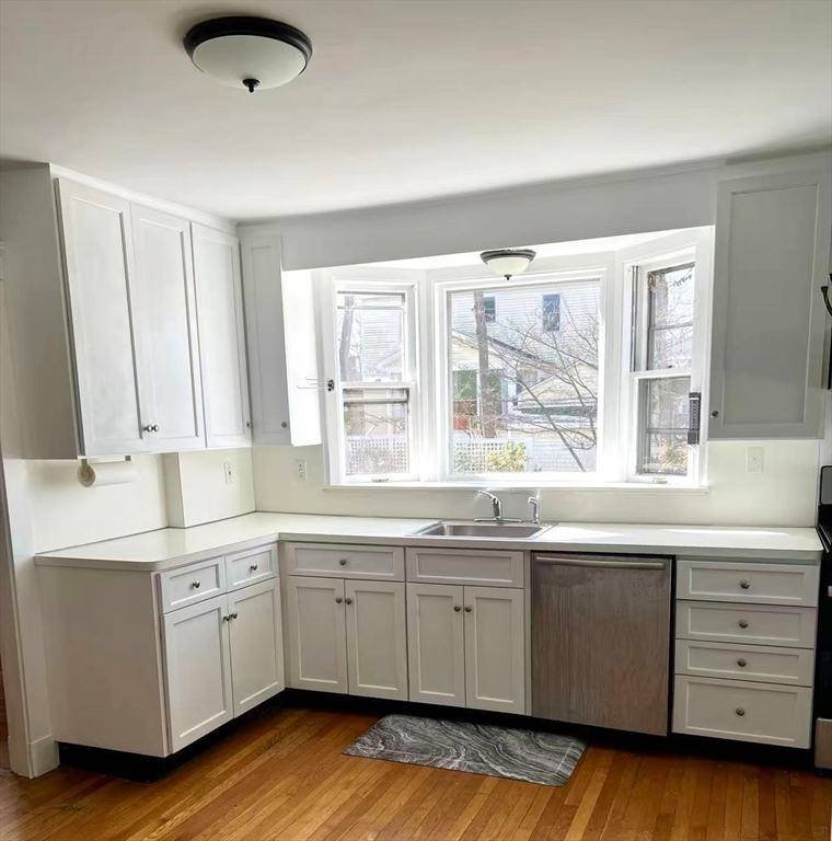 142 Jackson Street Newton, MA 02459 - Photo 9 of 16 a kitchen with a sink and cabinets