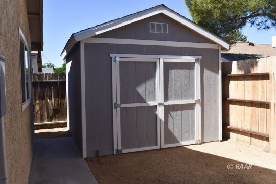 516 South Sorrel Street Ridgecrest, CA 93555 - Photo 29 of 32 a front view of a house with a yard