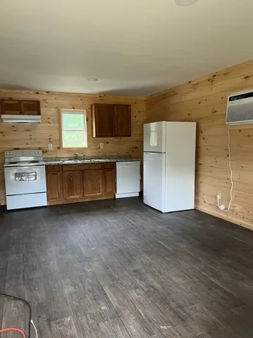 a kitchen with stainless steel appliances granite countertop a stove and a refrigerator
