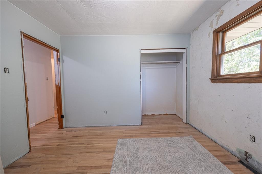 204 Marburger Road Evans City, PA 16033 - Photo 14 of 34 a view of an empty room with wooden floor and a window
