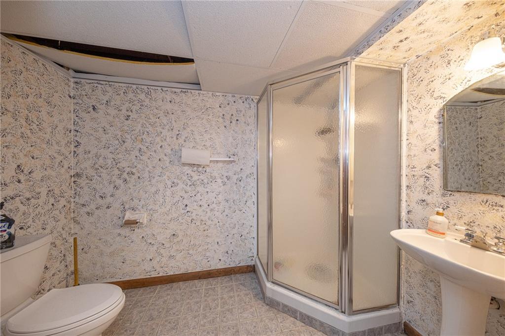 204 Marburger Road Evans City, PA 16033 - Photo 22 of 34 a bathroom with a shower toilet and sink