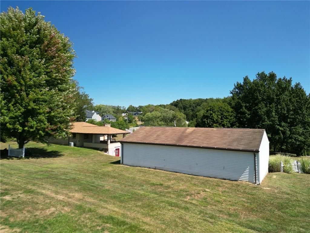 204 Marburger Road Evans City, PA 16033 - Photo 23 of 34 a view of a lake with a house in the background