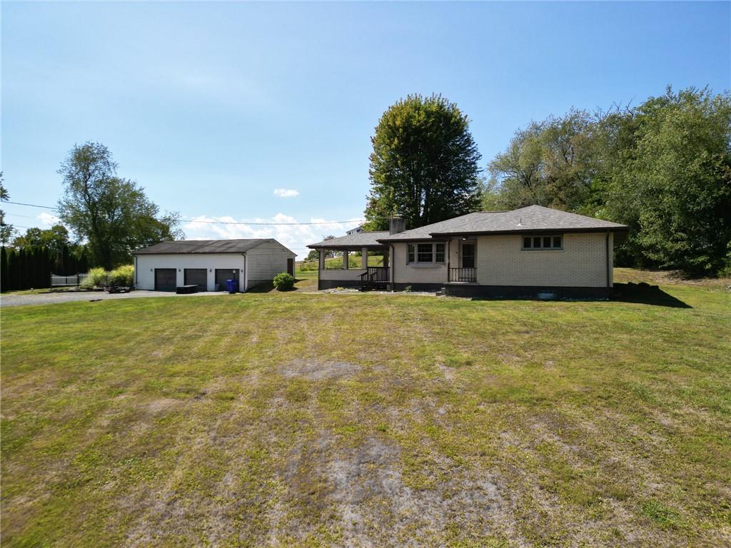 204 Marburger Road Evans City, PA 16033 - Photo 3 of 34 a front view of a house with garden