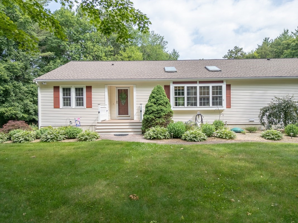 120 1/2 Lowell Road, Unit B Pepperell, MA 01463 - Photo 1 of 34 a front view of a house with a yard