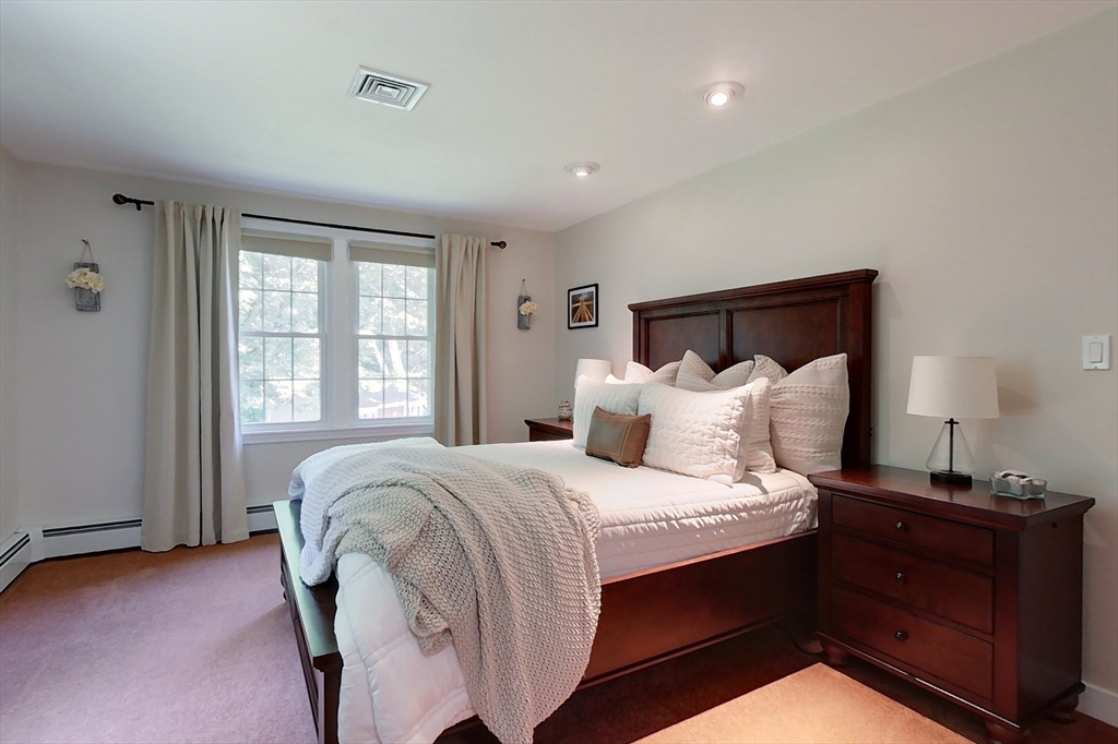 120 1/2 Lowell Road, Unit B Pepperell, MA 01463 - Photo 11 of 34 a bedroom with a bed and a window