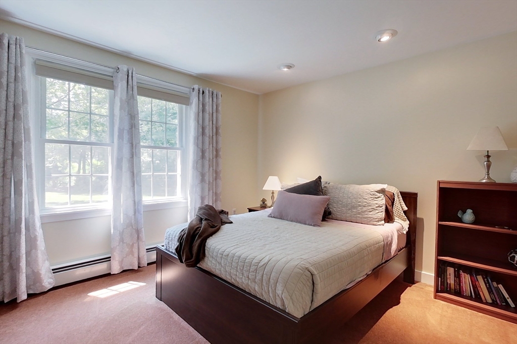 120 1/2 Lowell Road, Unit B Pepperell, MA 01463 - Photo 13 of 34 a bedroom with a bed and a window