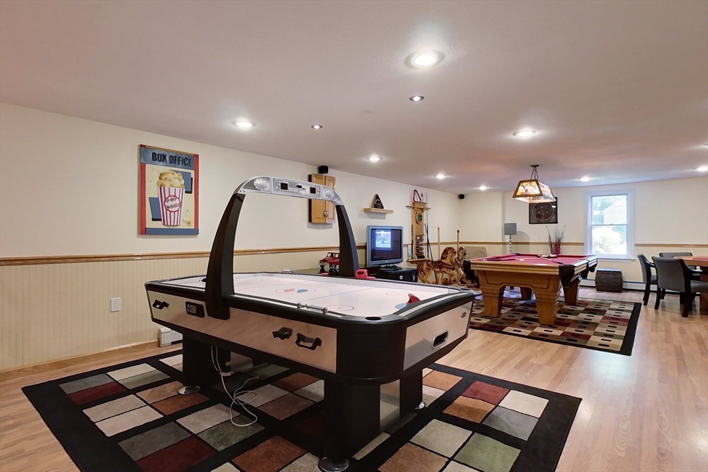 120 1/2 Lowell Road, Unit B Pepperell, MA 01463 - Photo 20 of 34 a living room with furniture a table and kitchen view