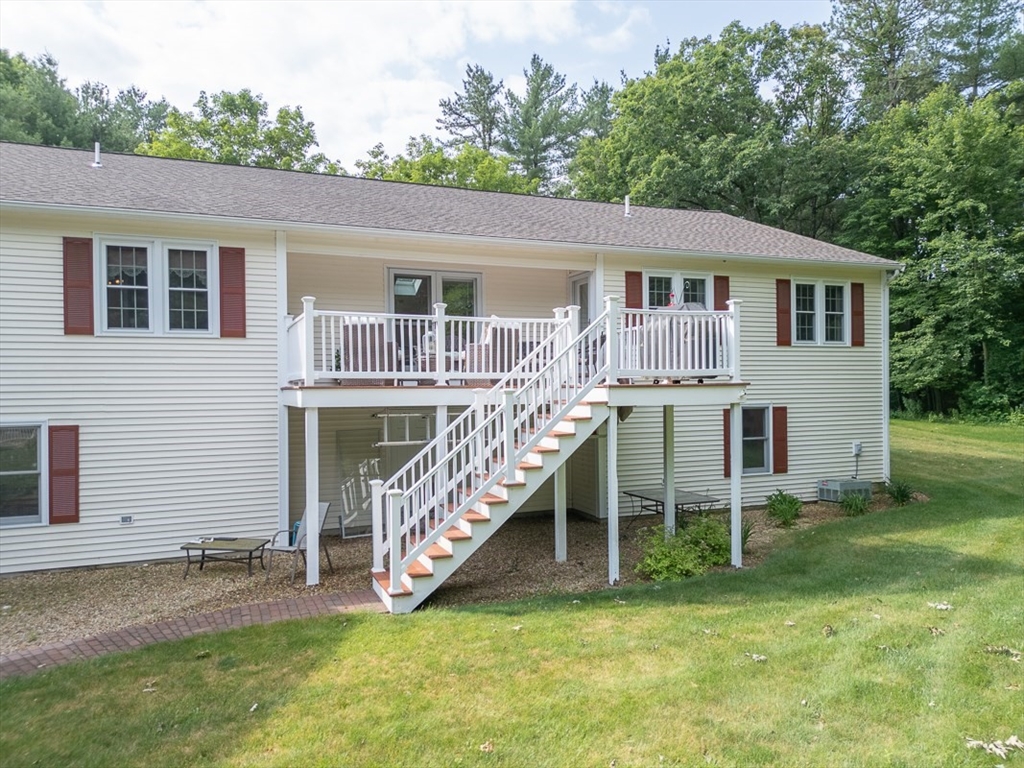 120 1/2 Lowell Road, Unit B Pepperell, MA 01463 - Photo 2 of 34 a view of a house with a yard