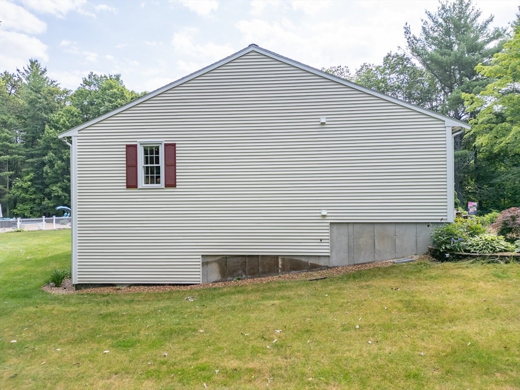 120 1/2 Lowell Road, Unit B Pepperell, MA 01463 - Photo 23 of 34 a view of a backyard of the house