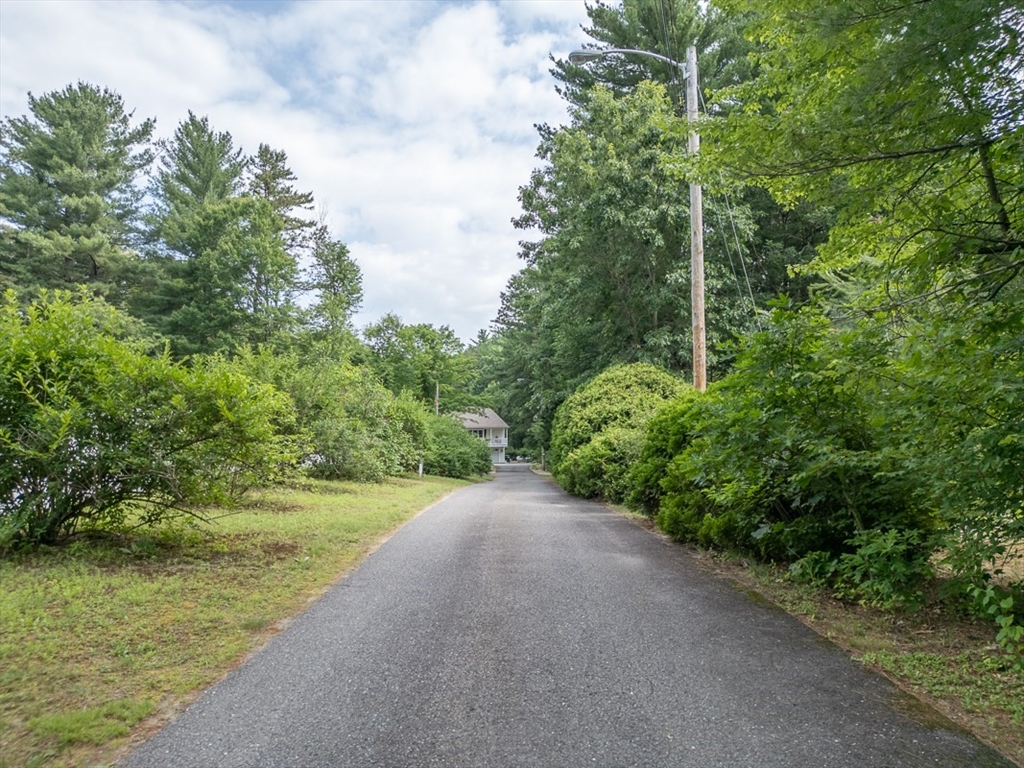 120 1/2 Lowell Road, Unit B Pepperell, MA 01463 - Photo 30 of 34 a view of a yard with a tree