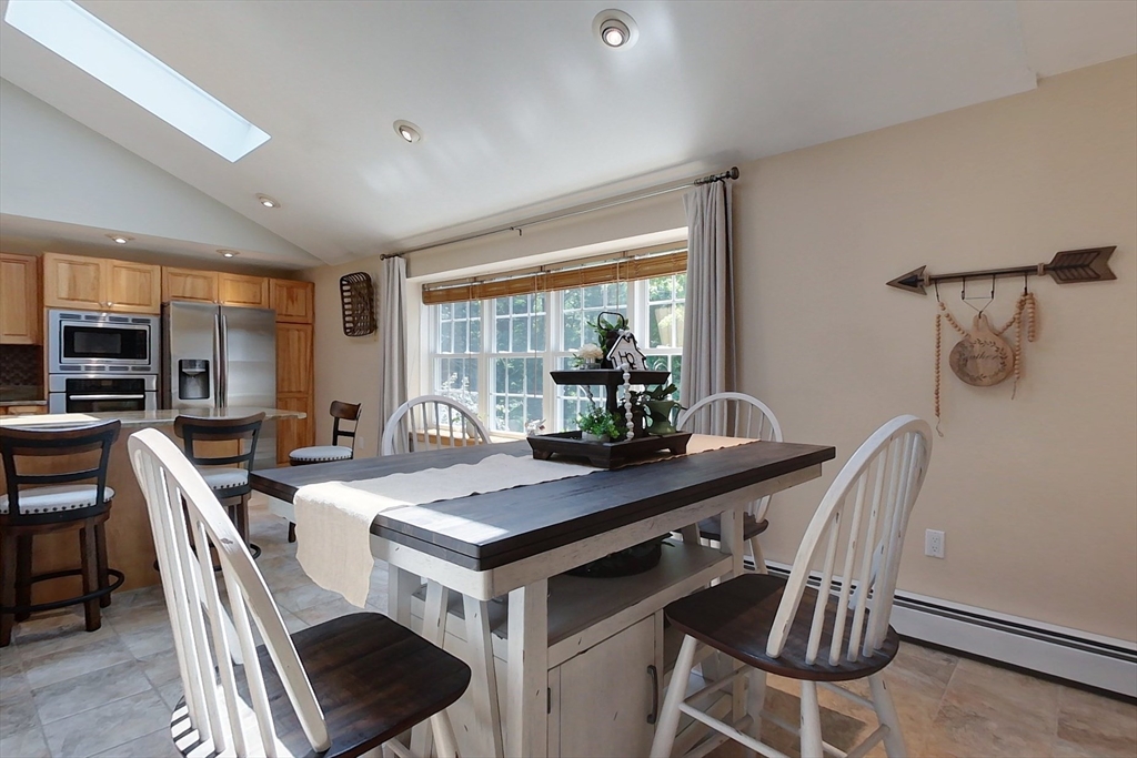 120 1/2 Lowell Road, Unit B Pepperell, MA 01463 - Photo 6 of 34 a view of a dining room with furniture window and outside view