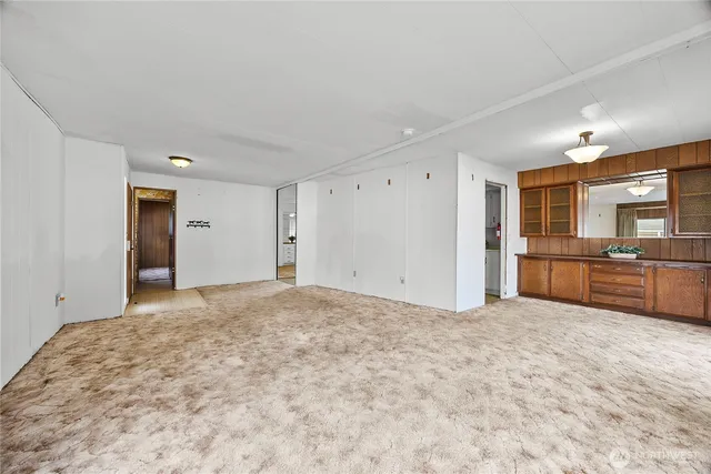 a view of a kitchen with a sink and a stove top oven