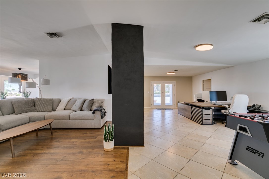 892 North Hollywood Boulevard Las Vegas, NV 89110 - Photo 23 of 81 This versatile space seamlessly blends relaxation and productivity, featuring warm wood and cool tile flooring.