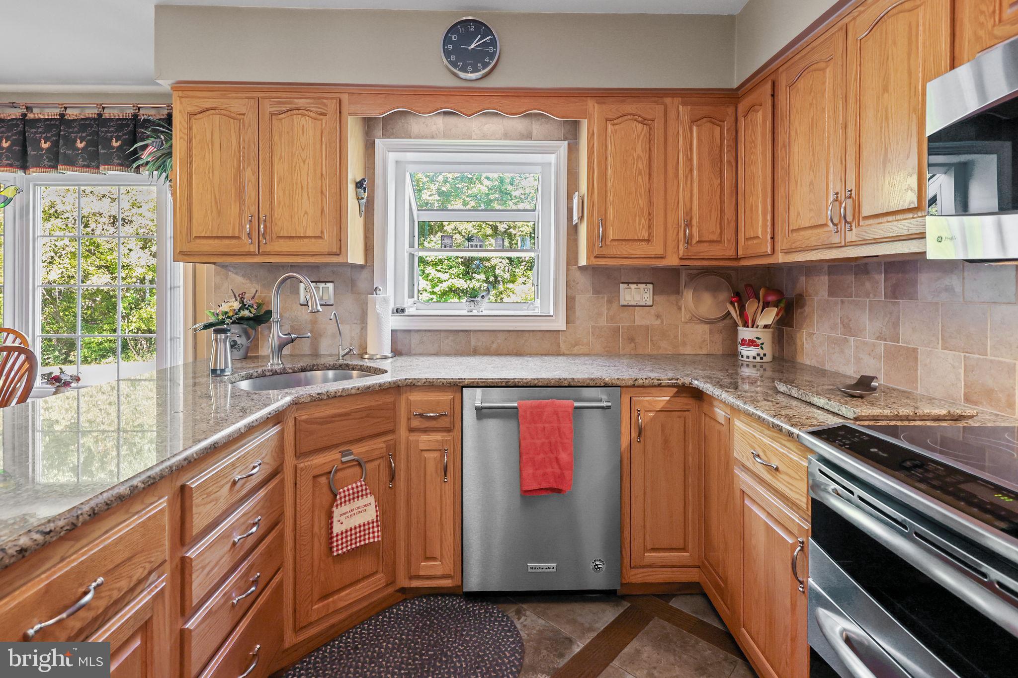 978 Weber Drive Yardley, PA 19067 - Photo 11 of 63 a kitchen with stainless steel appliances granite countertop a sink and a stove