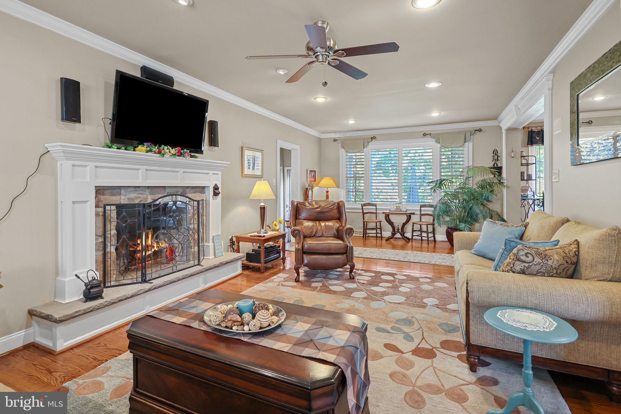 978 Weber Drive Yardley, PA 19067 - Photo 19 of 63 a living room with furniture a fireplace and a flat screen tv