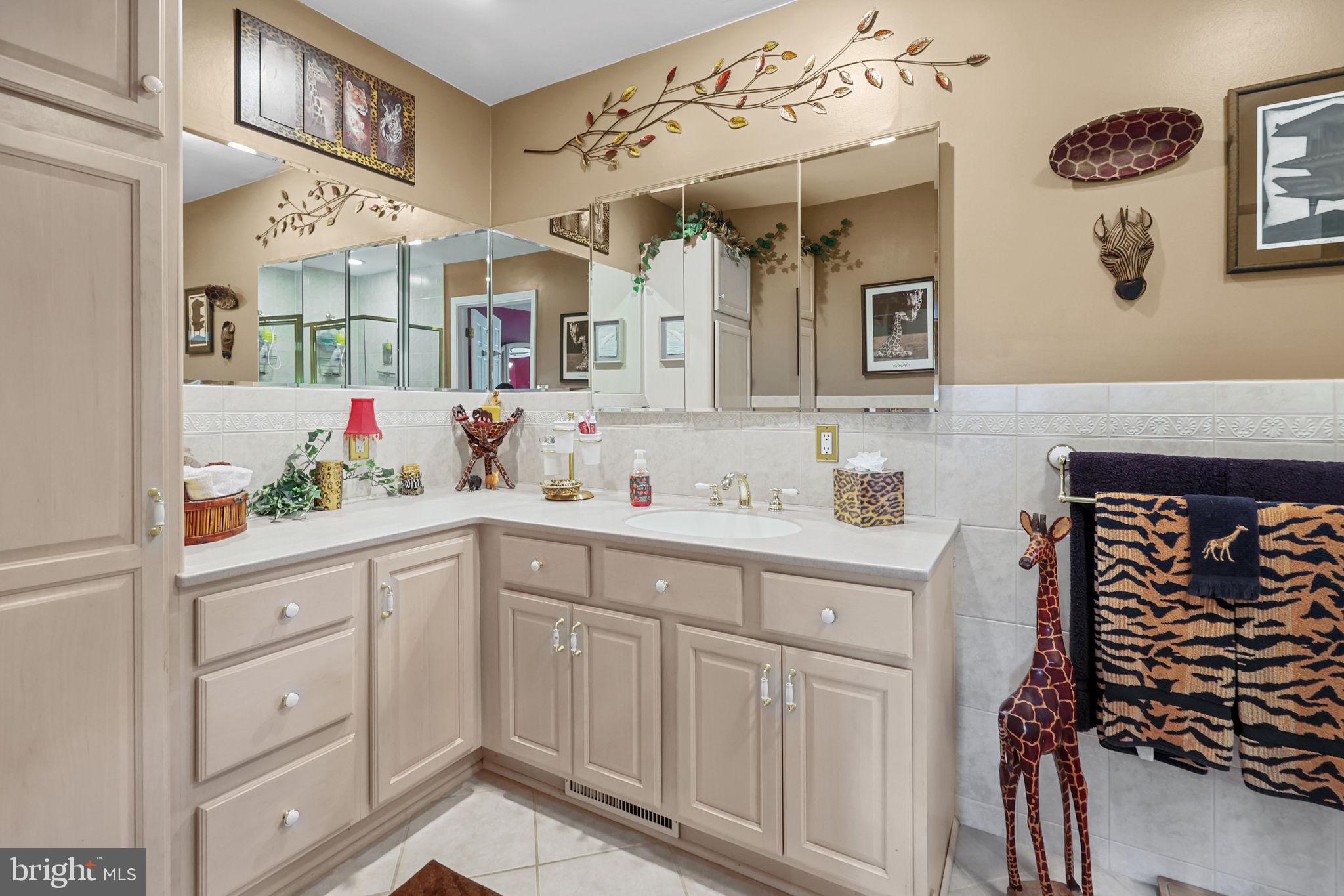 978 Weber Drive Yardley, PA 19067 - Photo 31 of 63 a spacious bathroom with a sink and a mirror