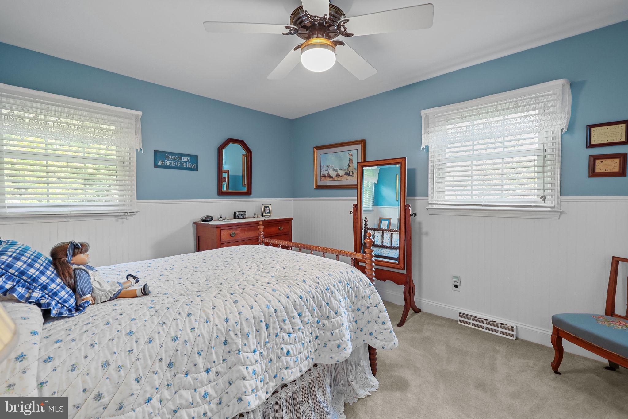 978 Weber Drive Yardley, PA 19067 - Photo 39 of 63 a bedroom with a bed and a chandelier