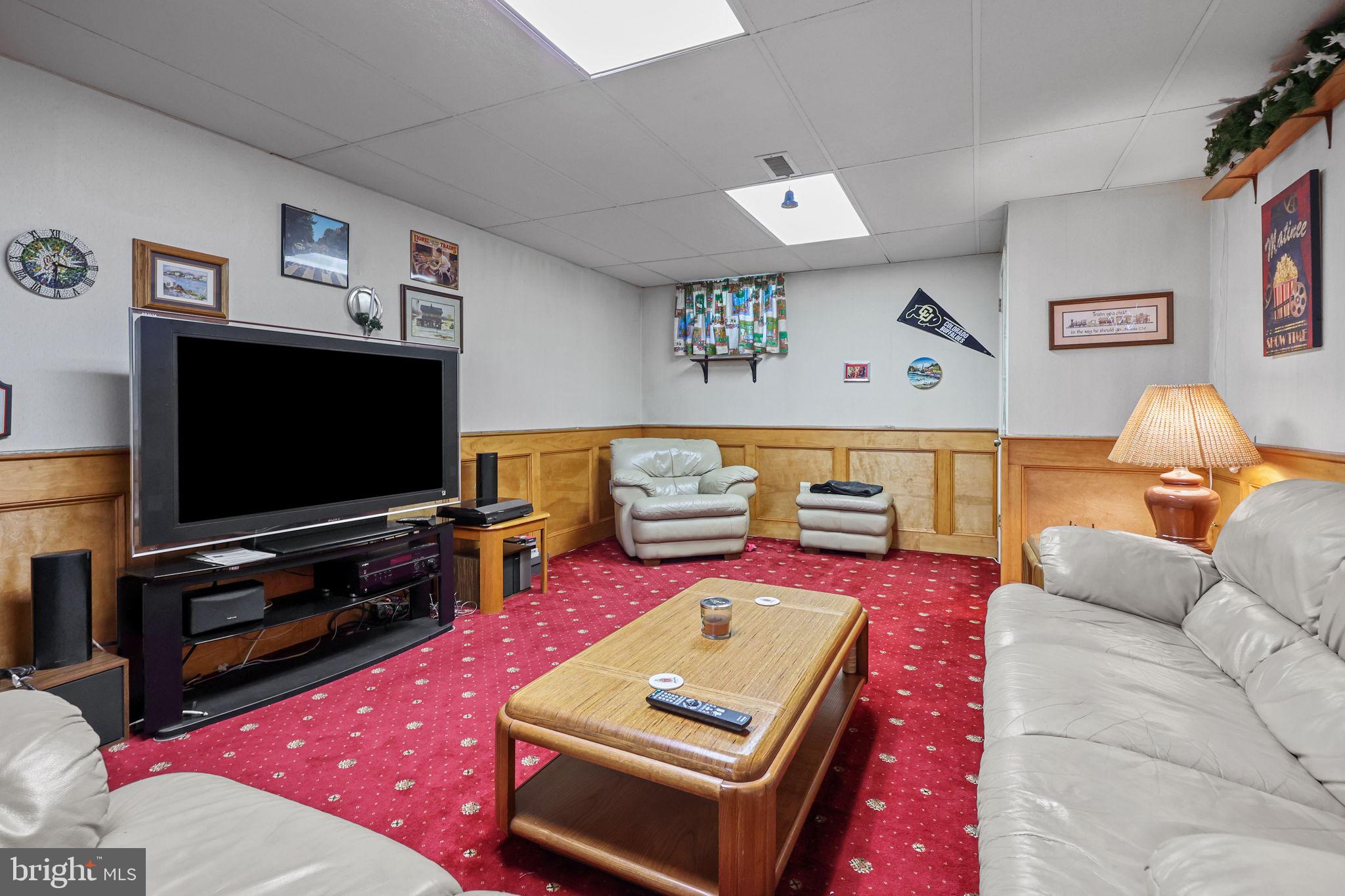 978 Weber Drive Yardley, PA 19067 - Photo 44 of 63 a living room with furniture and a flat screen tv