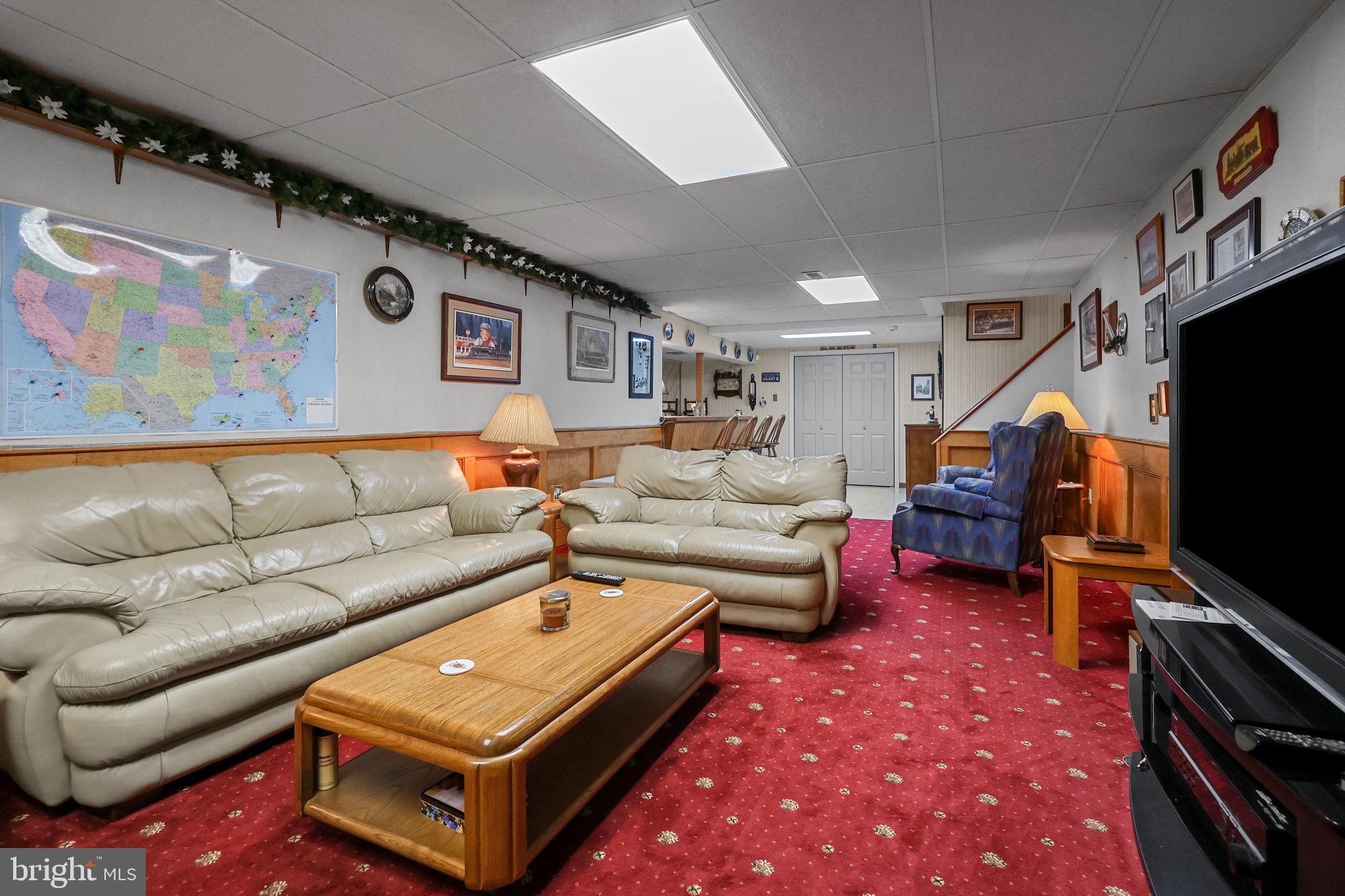 978 Weber Drive Yardley, PA 19067 - Photo 45 of 63 a living room with furniture and a flat screen tv