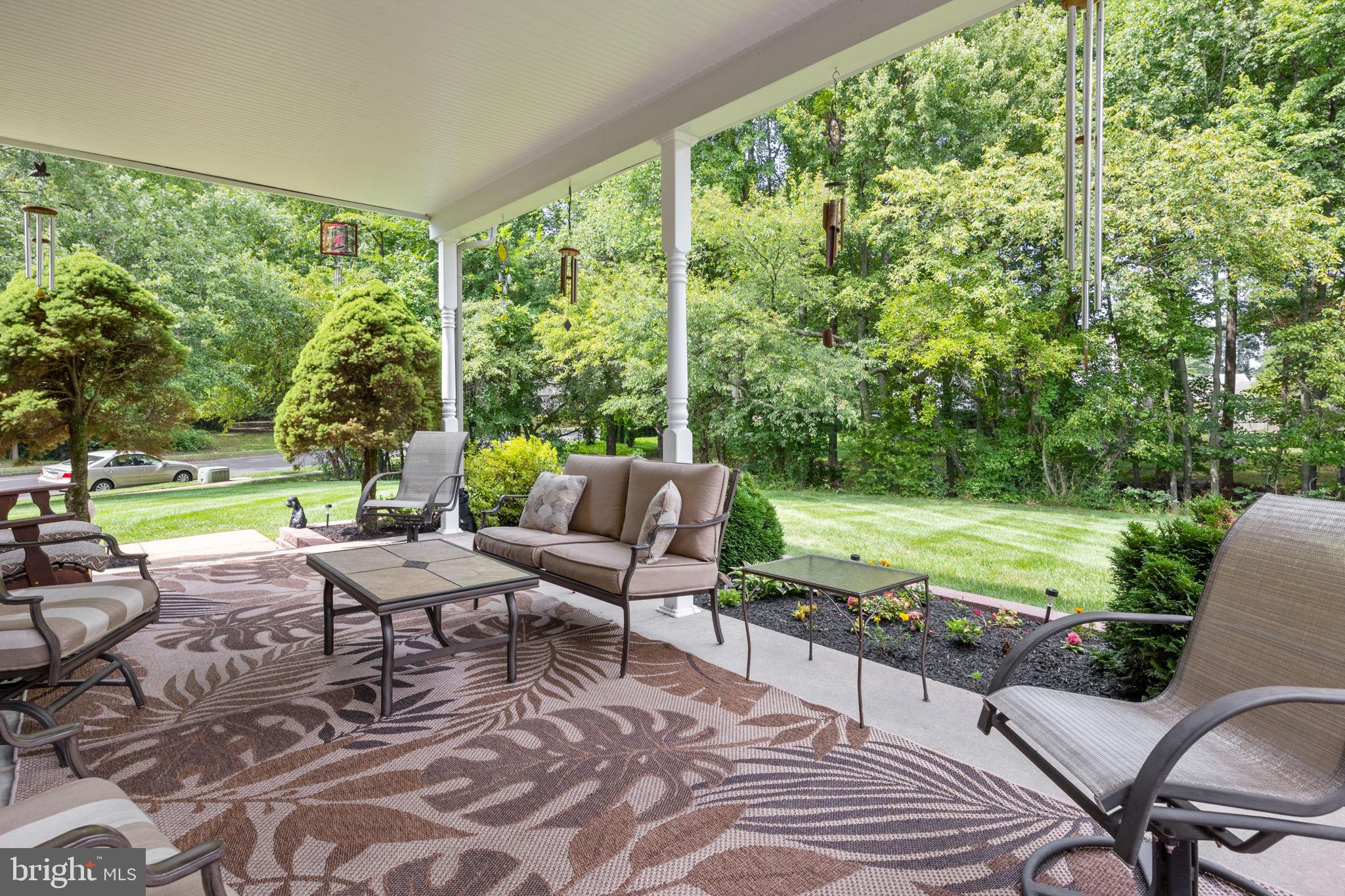 978 Weber Drive Yardley, PA 19067 - Photo 49 of 63 a view of a patio with lawn chairs floor to ceiling window and yard