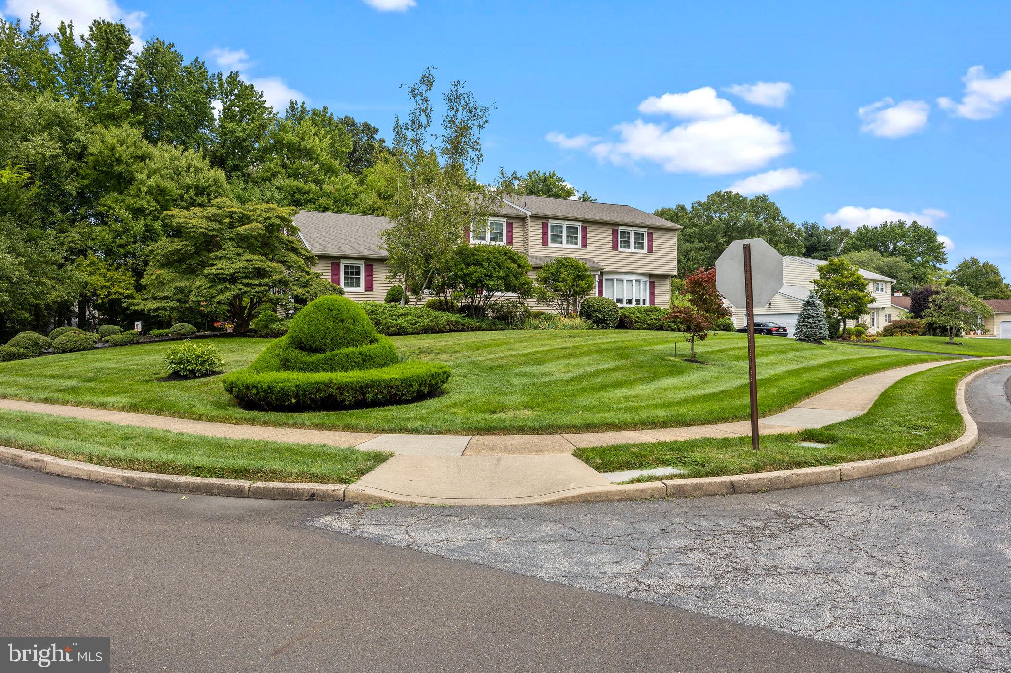 978 Weber Drive Yardley, PA 19067 - Photo 58 of 63 a front view of a house with a yard and garage