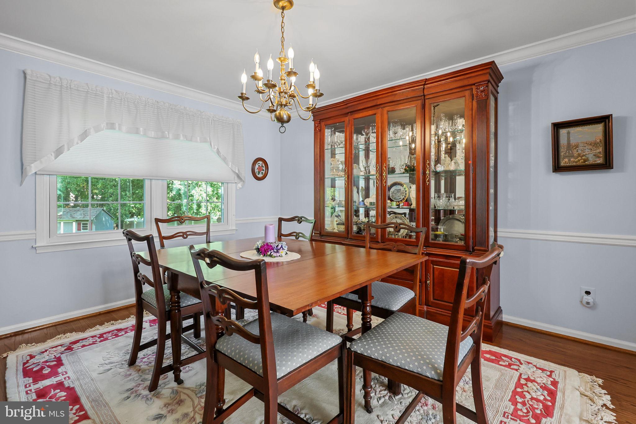 978 Weber Drive Yardley, PA 19067 - Photo 9 of 63 a dining room with furniture a rug and a chandelier