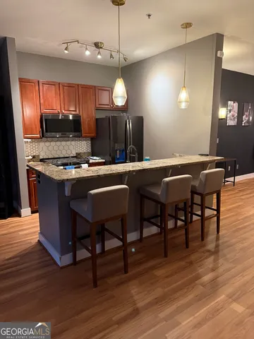 a kitchen with a table and chairs in it