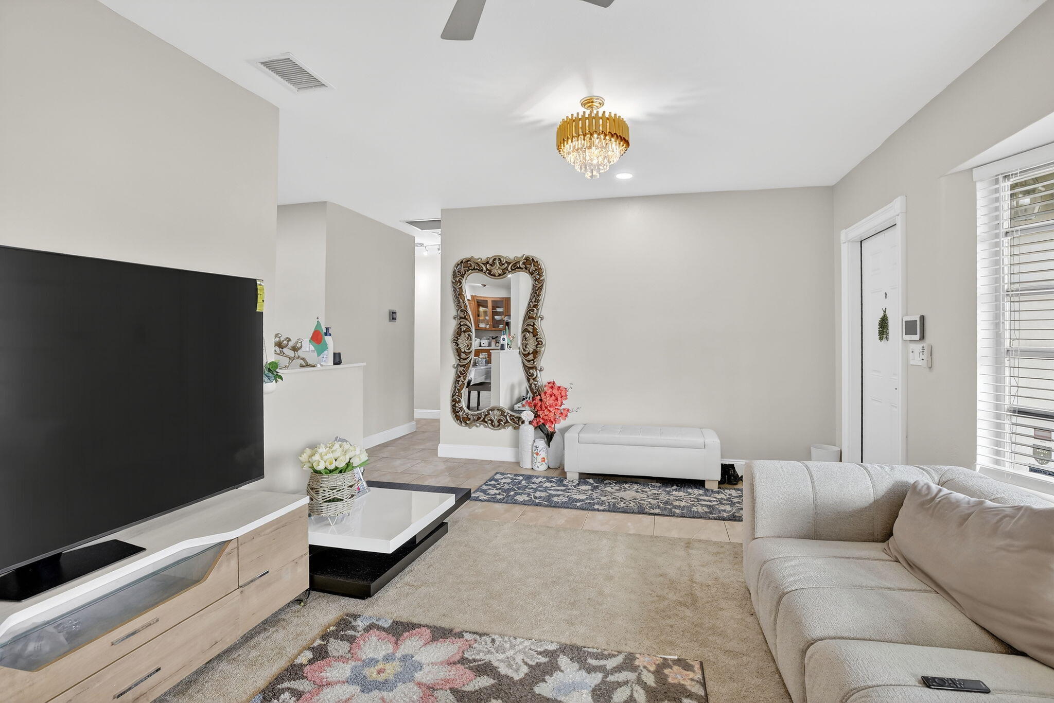 5507 McKinley Street Hollywood, FL 33021 - Photo 11 of 60 a living room with couch and a flat screen tv