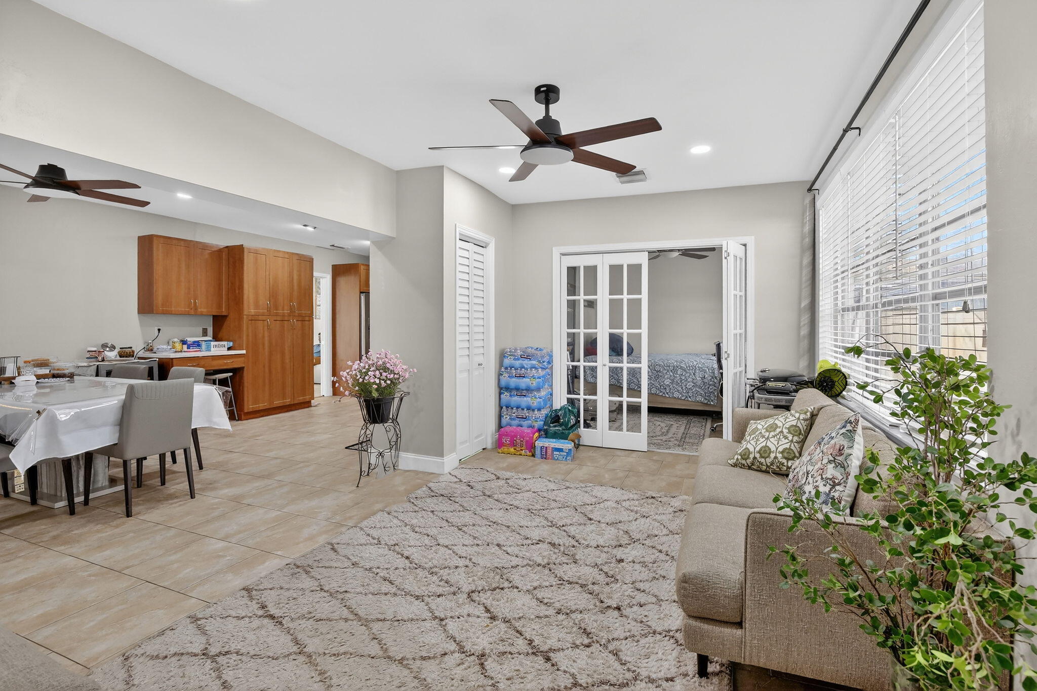 5507 McKinley Street Hollywood, FL 33021 - Photo 22 of 60 a living room with furniture a window and potted plants
