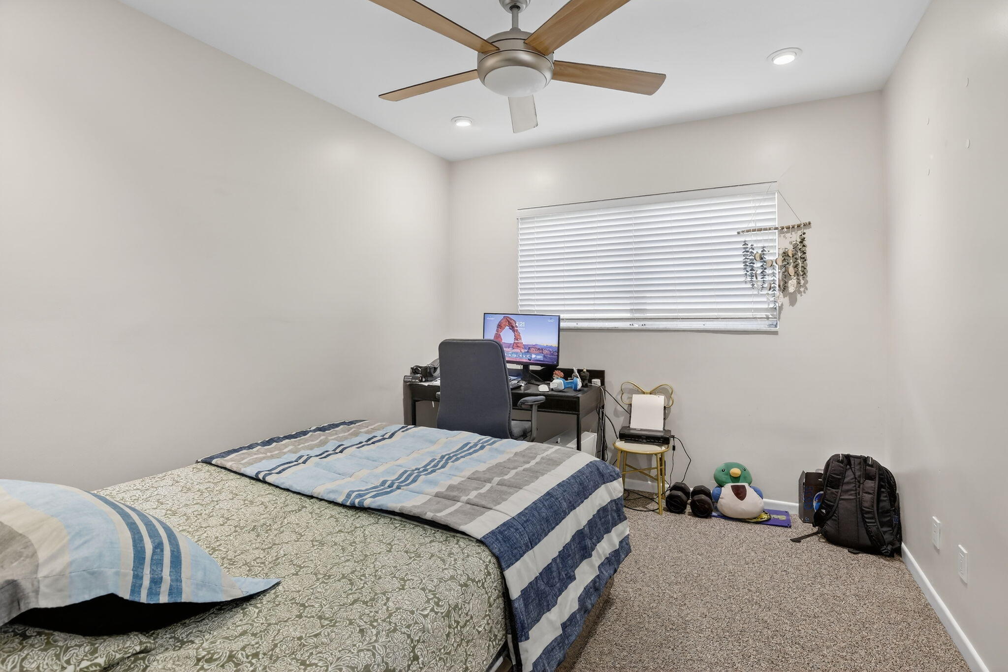 5507 McKinley Street Hollywood, FL 33021 - Photo 34 of 60 a bedroom with a bed and a chandelier