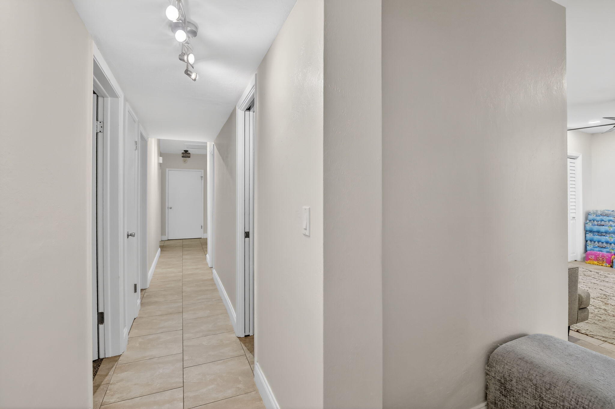 5507 McKinley Street Hollywood, FL 33021 - Photo 41 of 60 a hallway with a sink and a mirror