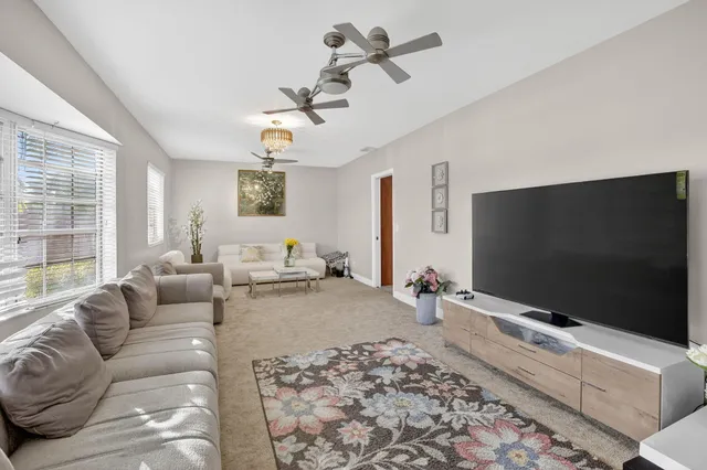 a living room with furniture and a window