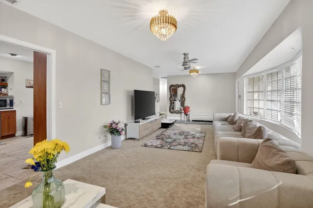 a living room with couch and a flat screen tv