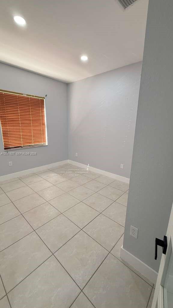 2120 Northeast 37th Road, Unit 1 Homestead, FL 33033 - Photo 24 of 30 an empty room with windows