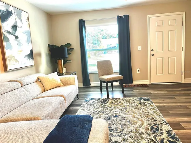 a living room with furniture and a window