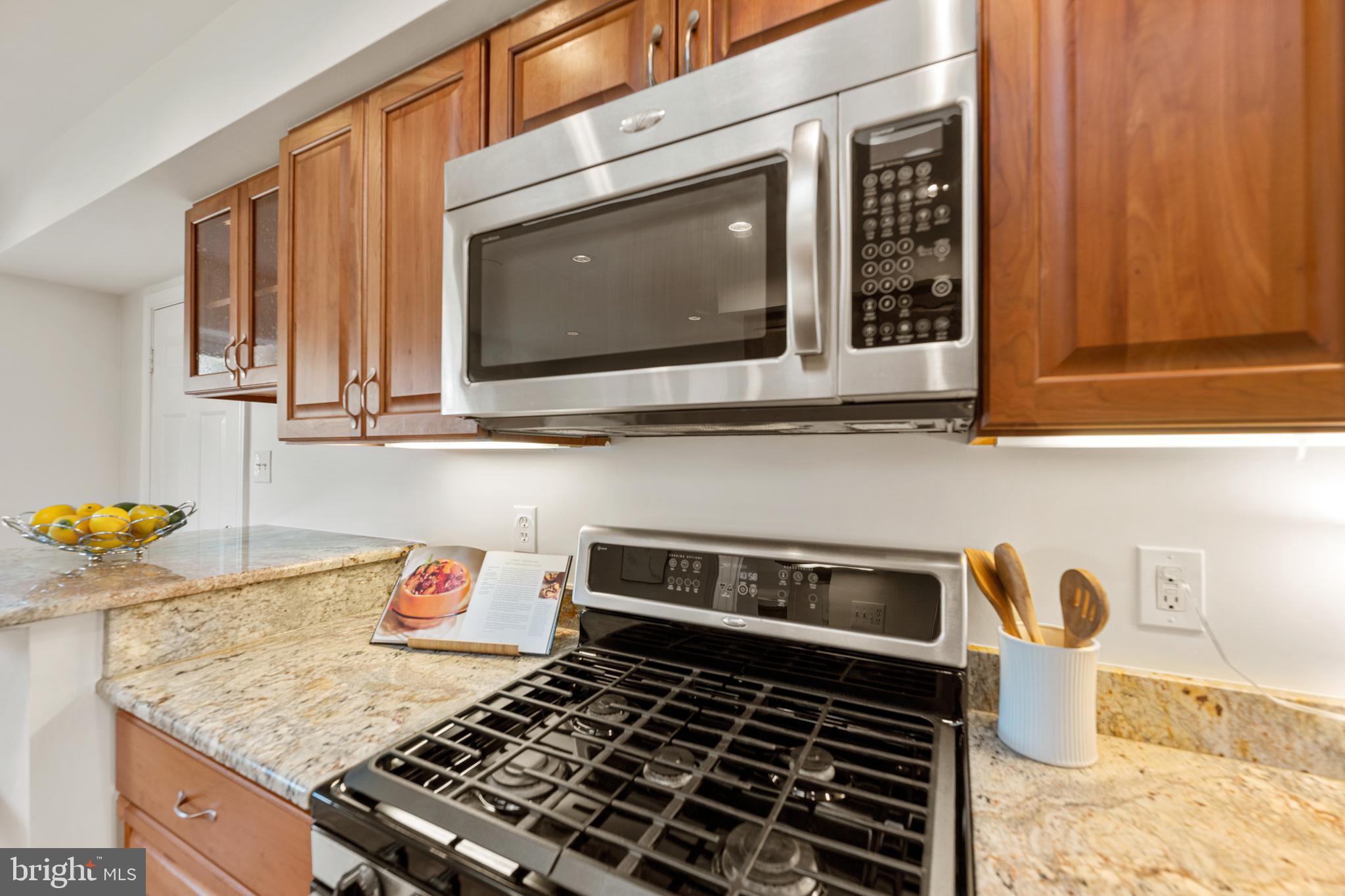 6800 Seton Court Springfield, VA 22152 - Photo 7 of 51 a kitchen with a stove a microwave and sink