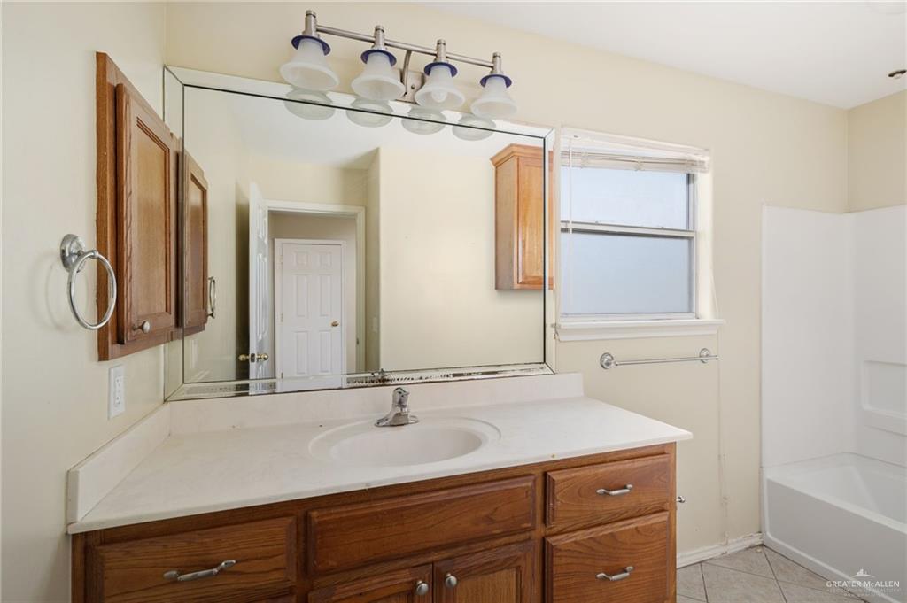 2601 Nassau Street Edinburg, TX 78541 - Photo 9 of 15 a bathroom with a sink and a mirror