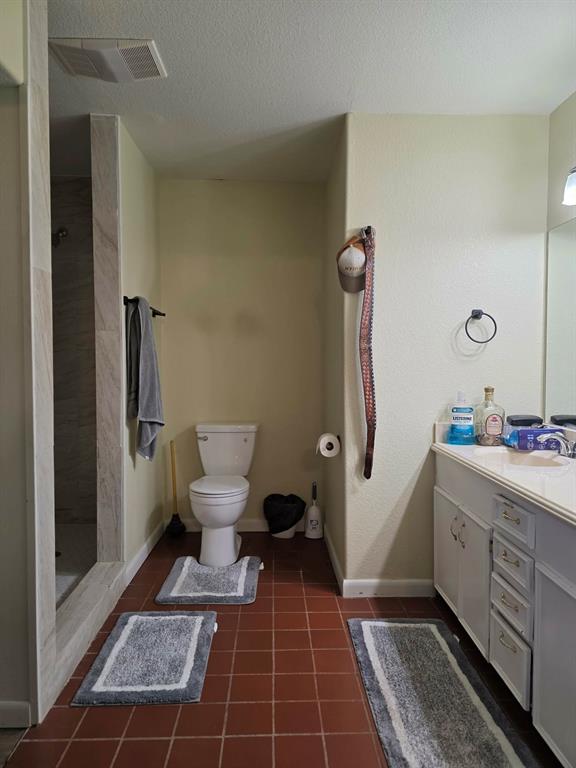 739 Bluebonnet Street Mexia, TX 76667 - Photo 16 of 28 a bathroom with a sink and a mirror